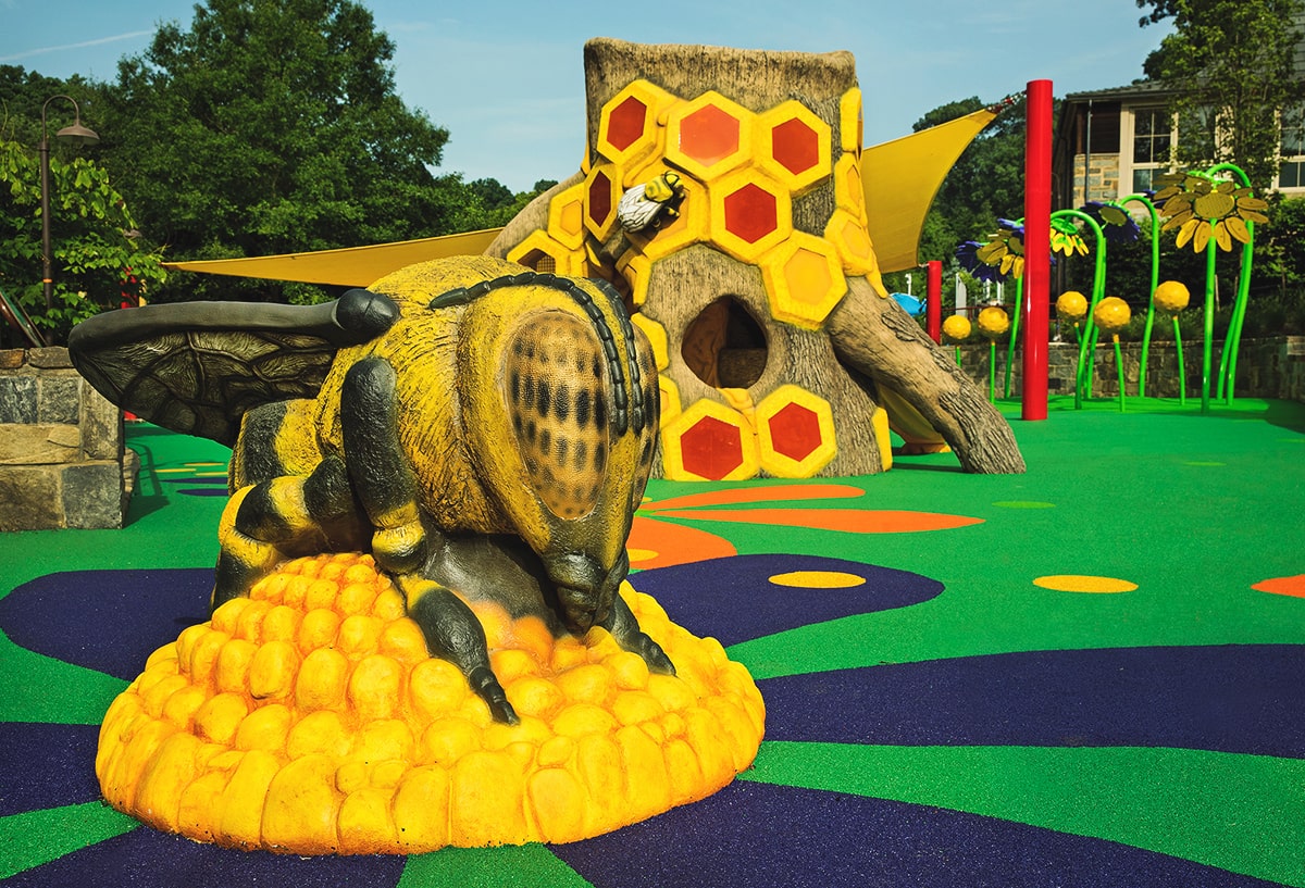 Pollinator-themed playground carvings